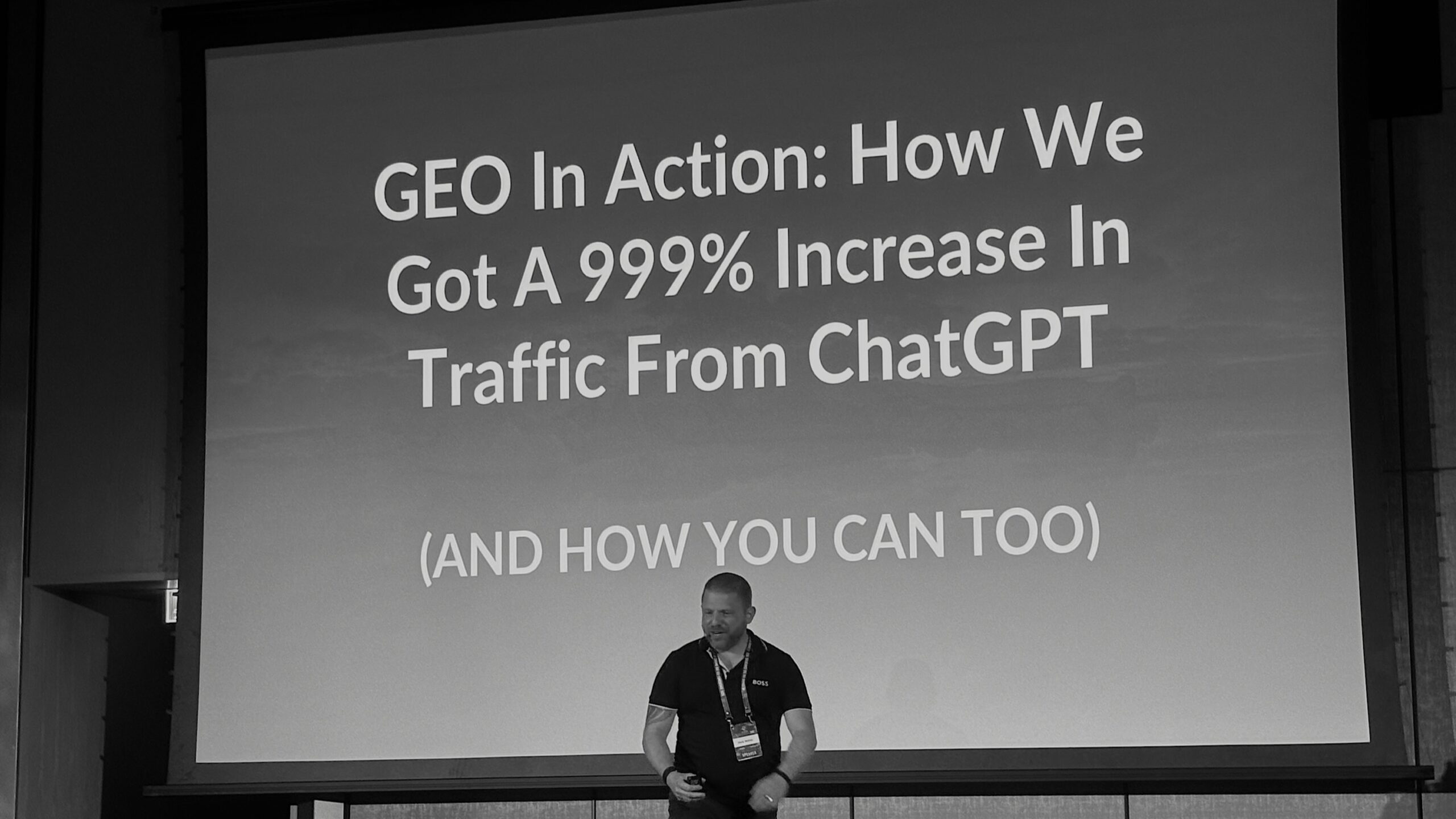 A confident speaker presents a case study on achieving a 999% increase in web traffic using ChatGPT at a digital marketing.